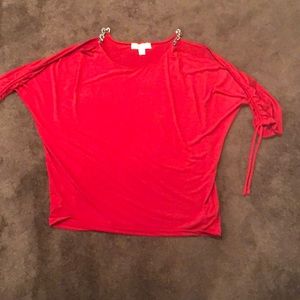 Red Michael Kors shirt chains on shoulder
